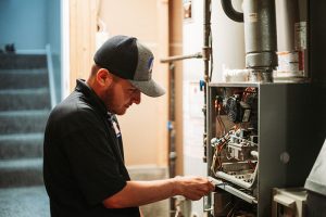 A1-technician-working-on-a-furnace